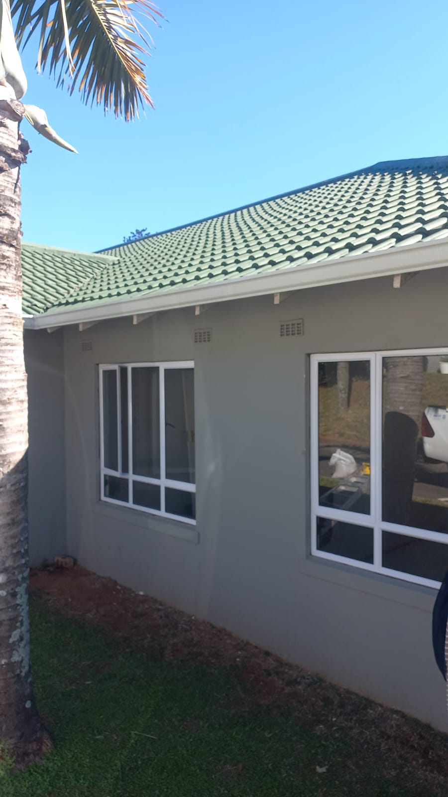 White aluminium windows installed on a grey Hillcrest home