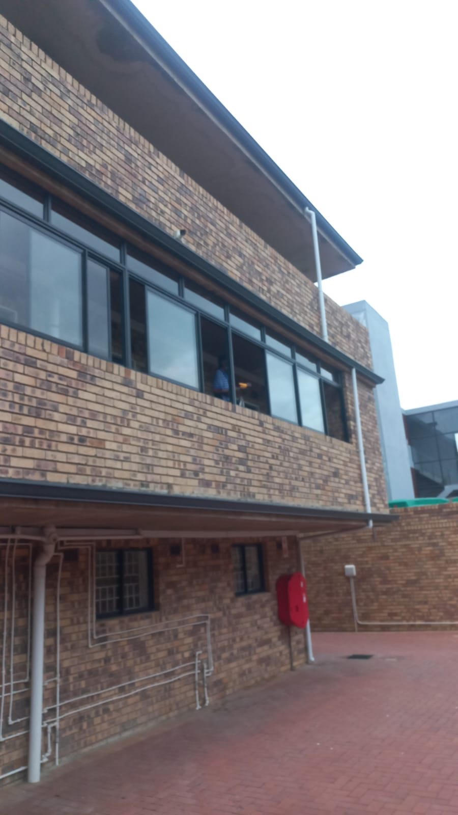 Aluminium windows installed on a brick building exterior