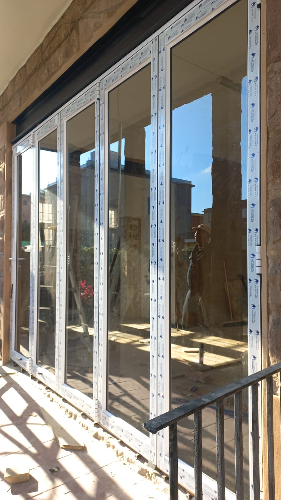 Large aluminium sliding door installation in progress